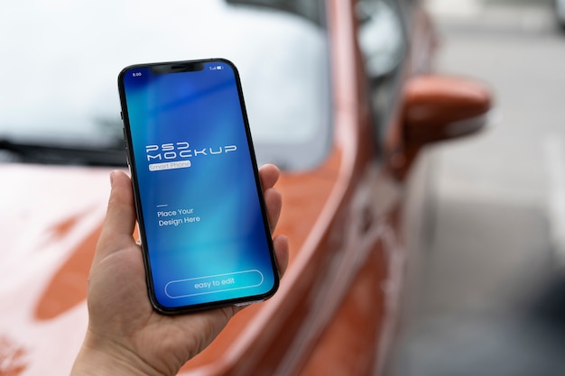 PSD mock-up design on smartphone touchscreen held by person