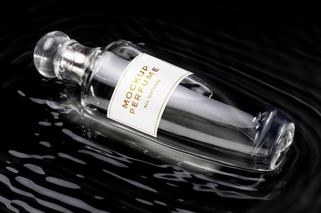 Mock-up of glass bottle of perfume with clear water