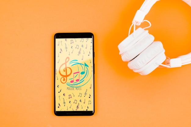 PSD mock-up headphones beside mobile