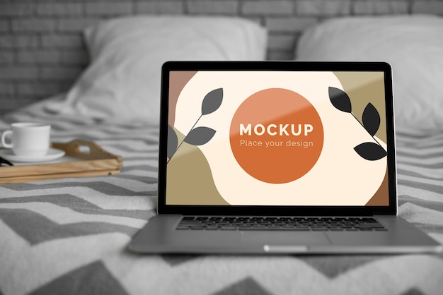 PSD mock up laptop on bed