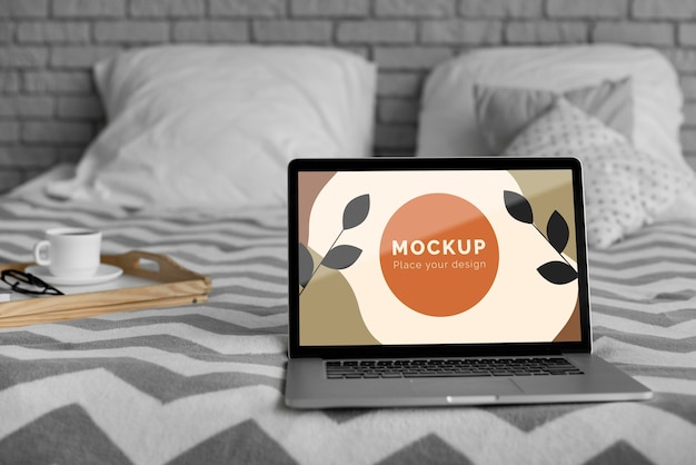 PSD mock up laptop on bed