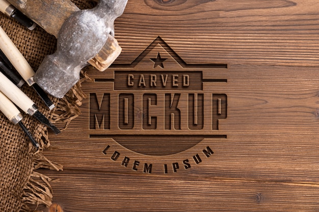 PSD mock-up logo with engraved effect on wood and tools