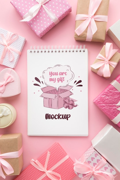 PSD mock-up notepad surrounded by gift boxes