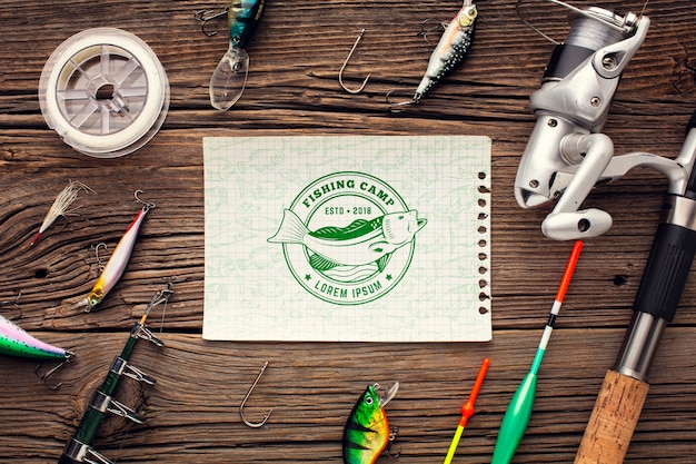 PSD mock-up paper surrounded by fishing accessories