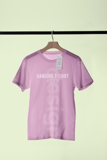 PSD mock-up t-shirt hanging on wooden hanger