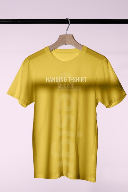 Mock-up t-shirt hanging on wooden hanger