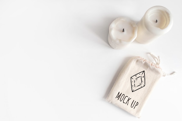 PSD mock up of tarot deck cotton bag and candles on white