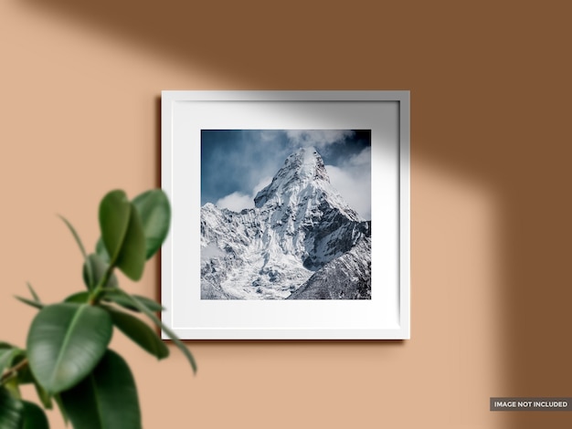 Mockup blank photo frame in color wall