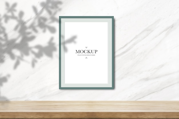 Mockup blank photo frame on white marble wall