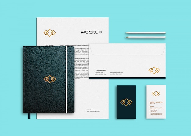 Mockup of business card, letterhead and notebook