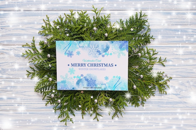 Mockup of Christmas greeting card and fir branches