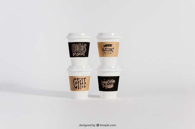 Mockup of four take away coffee cups