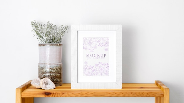 mockup frame beside flowers
