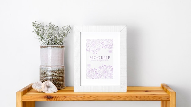 Mockup frame beside flowers