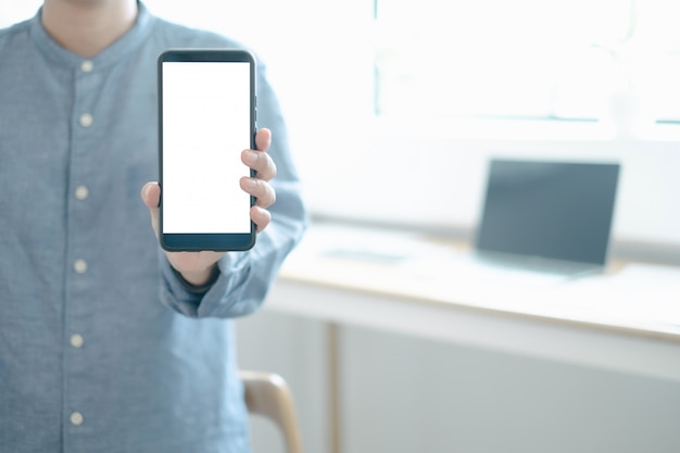 Mockup image of engineers showing smartphone design building project in office