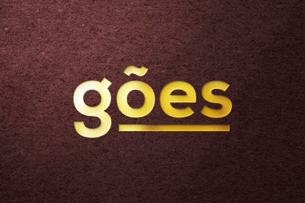 PSD mockup met gouden logo in reliëfeffect met ruwe gestructureerde achtergrond