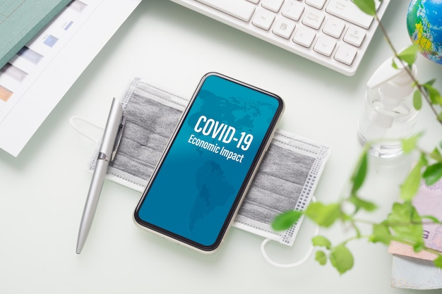 PSD mockup mobiele telefoon voor zakelijke impact op covid 19