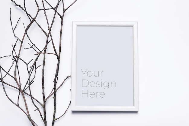 PSD mockup of photo frame with grass branches