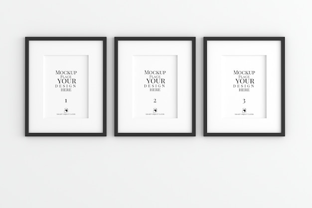 PSD mockup of photo frames hanging on wall