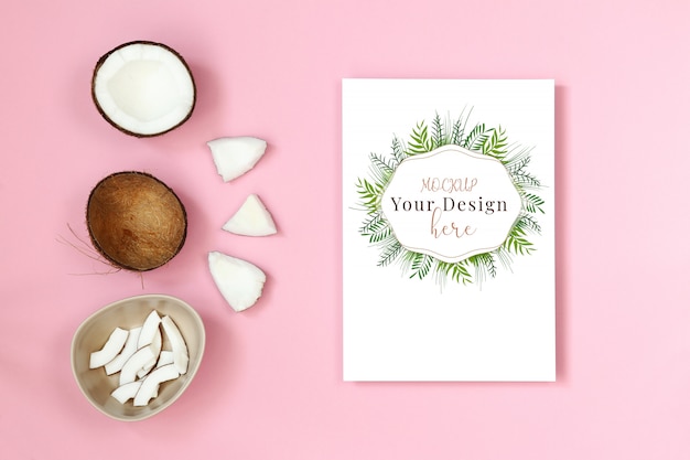 Mockup postcard with piece of coconut on pink background