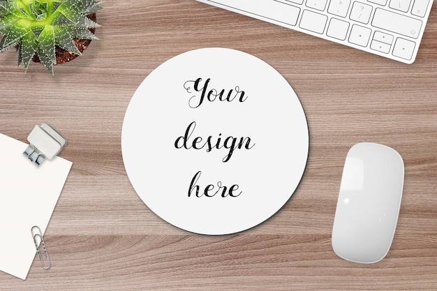 Mockup of round mouse pad on a work table