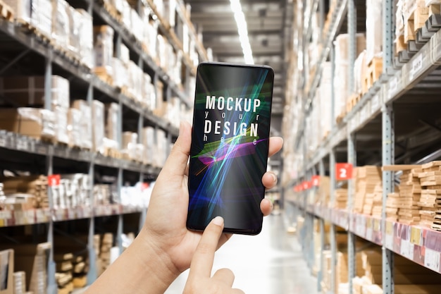 PSD mockup smartphone in warehouse for logistic wholesale storehouse