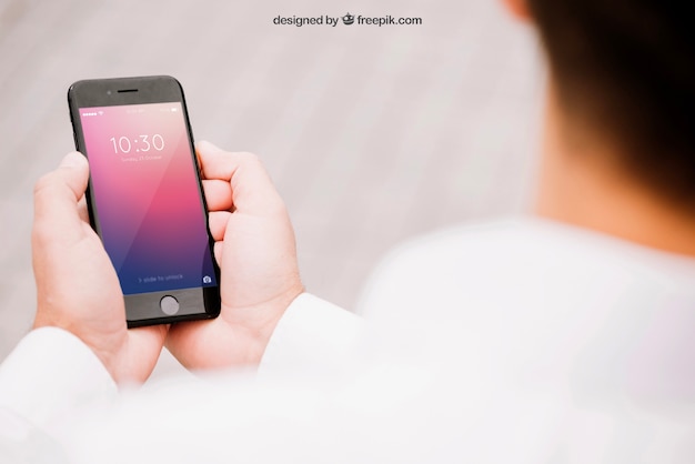 PSD mockup of smartphone with blurred man
