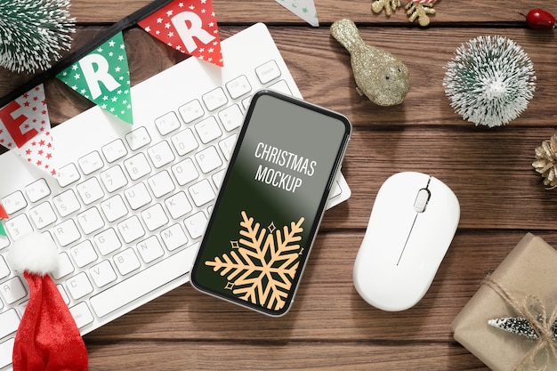 PSD smartphone di mockup su fondo di legno per lo sfondo di natale e capodanno