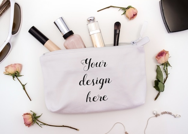 Mockup of a white cotton cosmetic bag with cosmetics inside