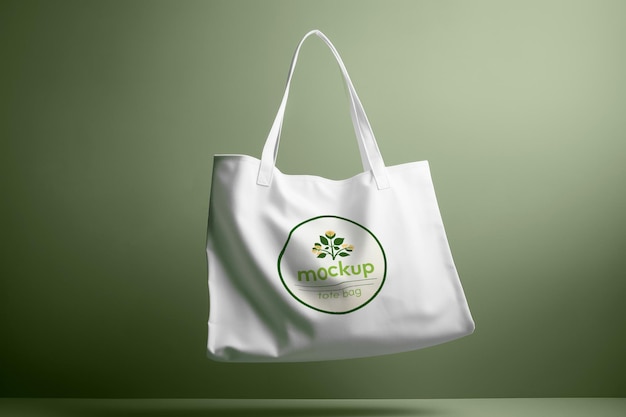 Mockup of a White Tote Bag Logo on a Green Background