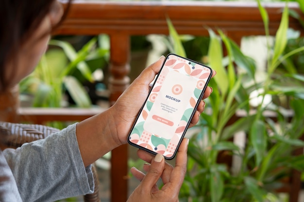 Model  holding smartphone mockup