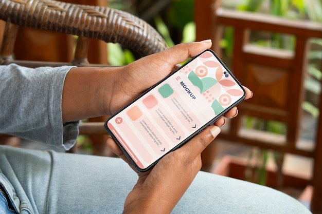 model  holding smartphone mockup