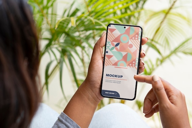 Model  holding smartphone mockup