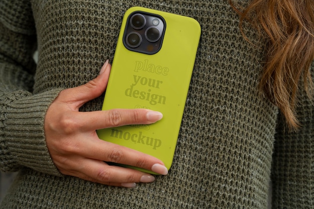 PSD model holding smartphone with cool case