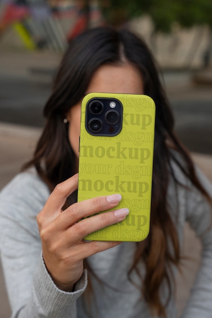 PSD model holding smartphone with cool case