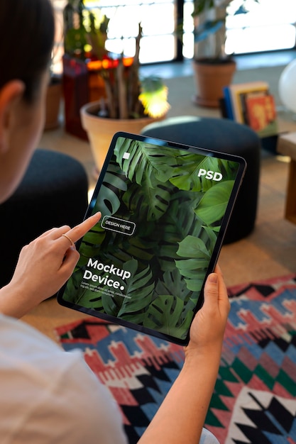 Model holding a tablet mockup