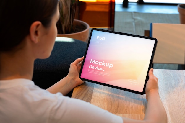 Model holding a tablet mockup