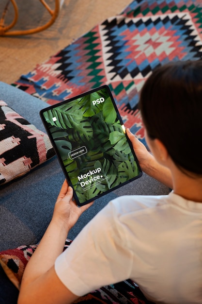 model holding a tablet mockup