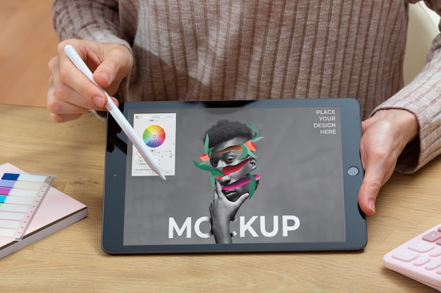 Model holding tablet and pencil front view