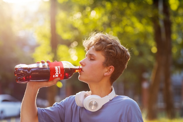 Model posing with bottle mockup