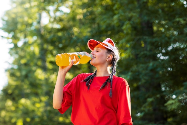 Model posing with bottle mockup