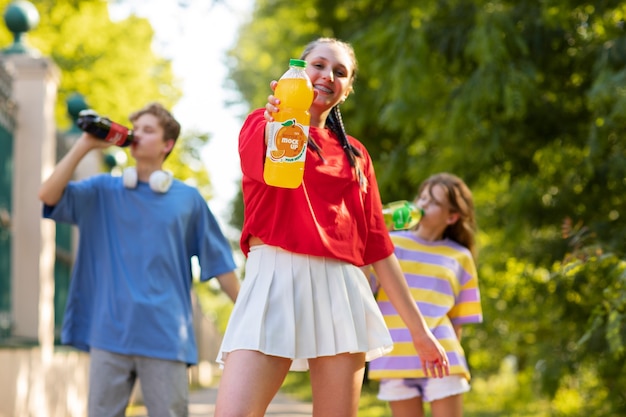 Models posing with bottle mockup