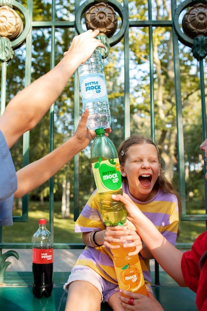 Models posing with bottle mockup