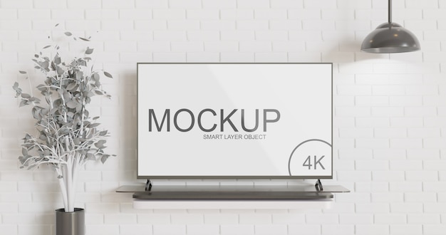 Modern tv mockup on table against brick wall