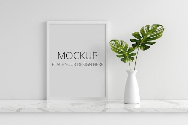 Monstera plant in vase with picture frame mockup