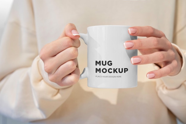 PSD a mug mockup in hands