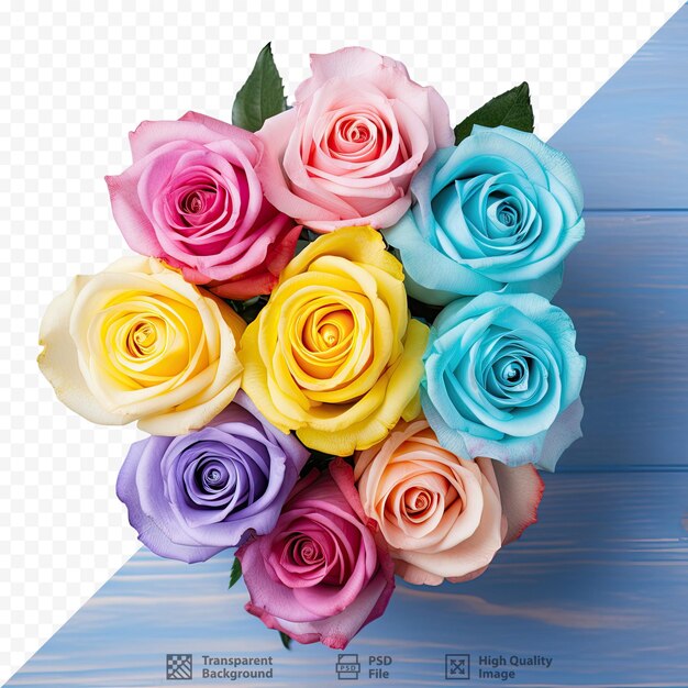 Multicolored roses arranged on a blue wooden table captured from above