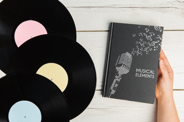 Music elements book with vinyl records top view