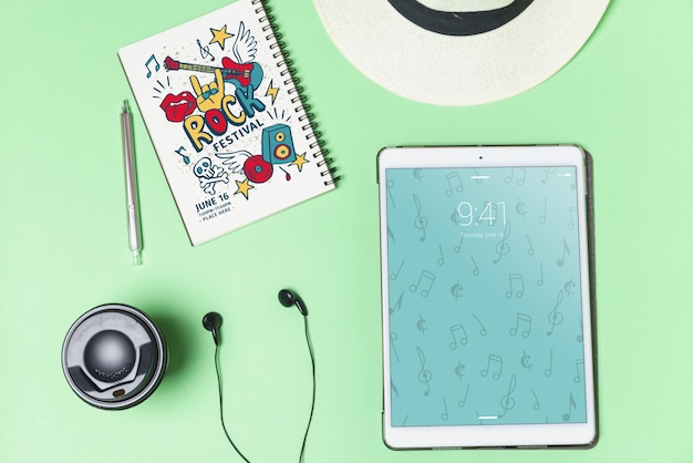 PSD music mockup with earphones and tablet in top view