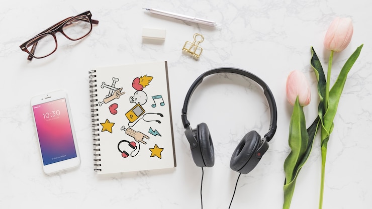 PSD music mockup with headphones smartphone and notebook